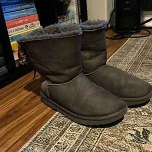 Grey children’s Uggs with bows on the back